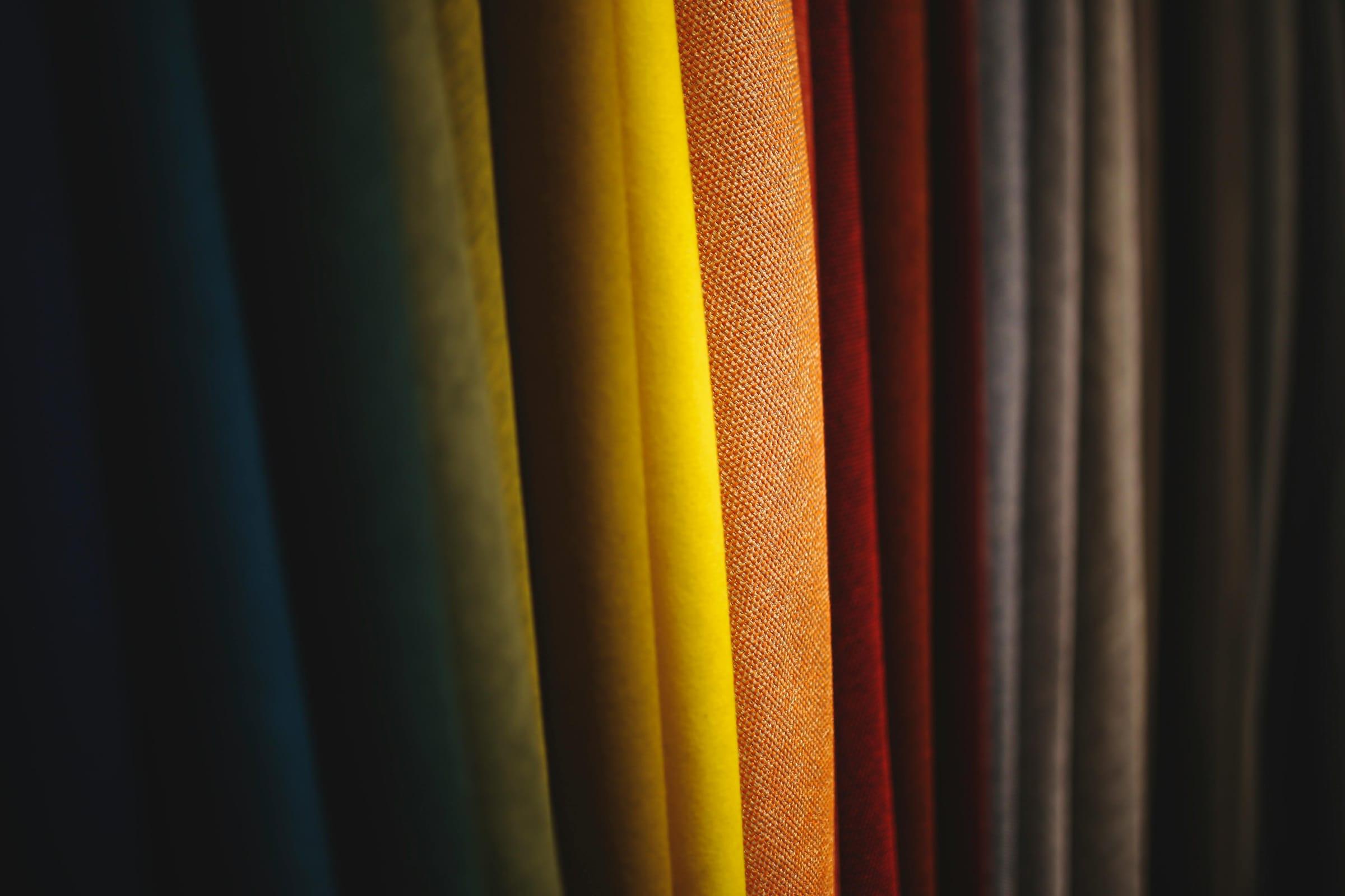 Inside the ZEBA Interiors fabric library — velvets, linens, and richly textured weaves on display.